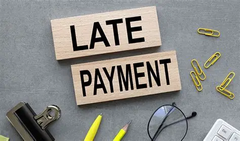 Business professional reviewing overdue invoices - late payment recovery and debt collection UK